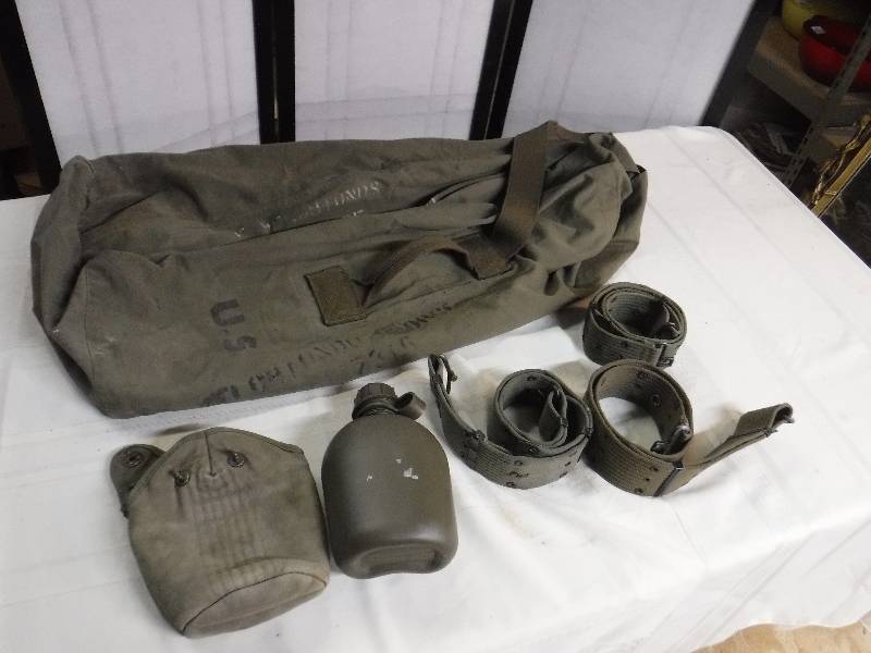lot 9840 image: US Army Ruck sack duffel bag, canteen, duty belts and more