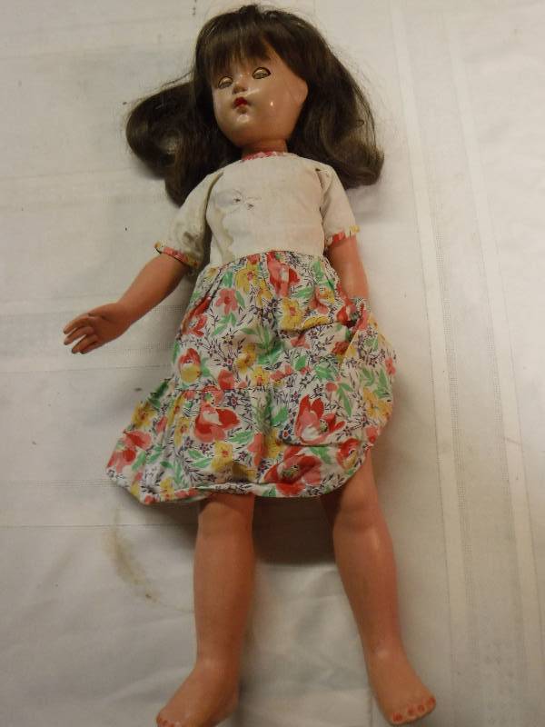 lot 6749 image: Porcelain doll that has been played with