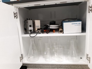 lot 7278 image: Contents Of Drawers And Cabinets, Glass Beakers, Centrifuge, Buret Clamps, And More