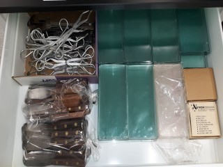 lot 7285 image: Assorted Items in Drawers Set, Spatulas, Tongs, Slicks,Tins, Flasks, Mortor & Pestle
