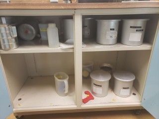 lot 7527 image: Contents of Cabinet (Aluminum Cannisters and Pitchers)