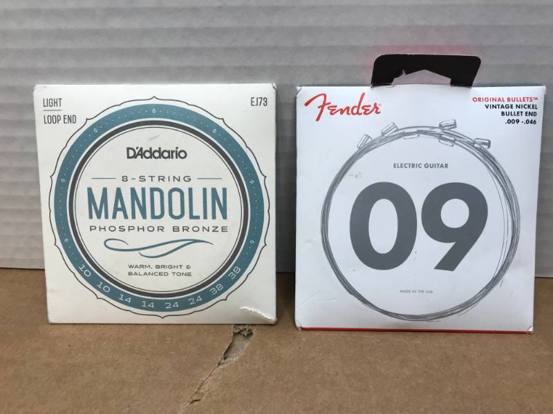 lot 3024 image: DADDARIO MANDOLIN STRINGS  FENDER ELECTRIC GUITAR STRINGS