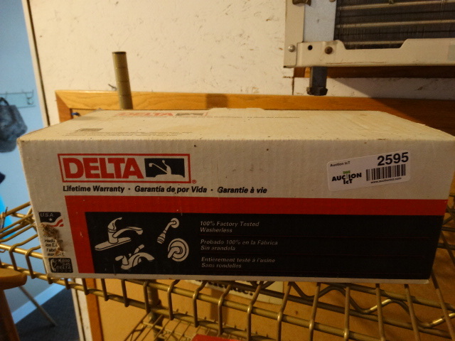 lot 2595 image: Delta bathroom faucet in box