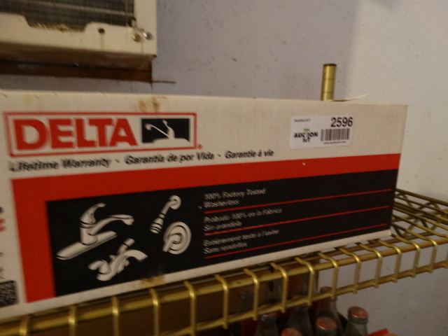 lot 2596 image: Delta bathroom faucet in box