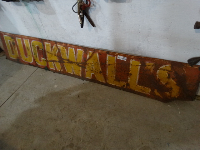 lot 2665 image: Vintage metal DUCKWALLS sign