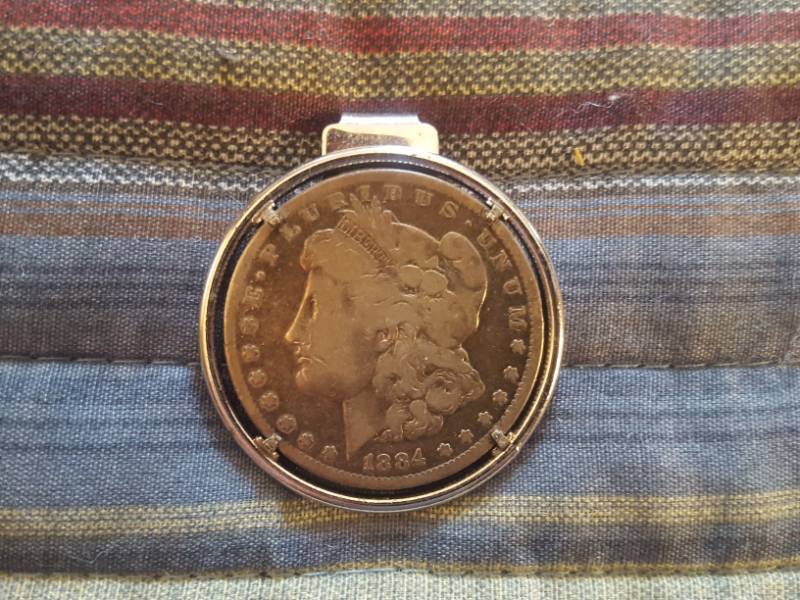 lot 3871 image: Money Clip with 1884 Morgan Silver Dollar
