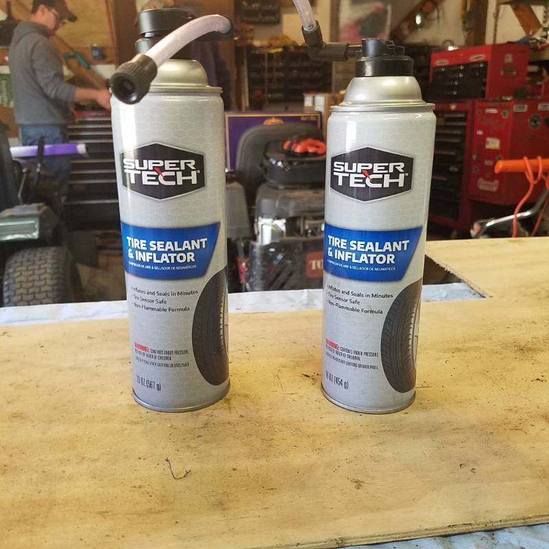 lot 3657 image: 2 Cans of tire sealant and inflator