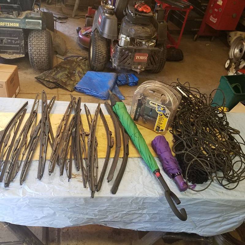 lot 3718 image: 2 Cargo Nets, 2 Umbrellas, Tire Inflator, and Assortment of windshield wiper blades