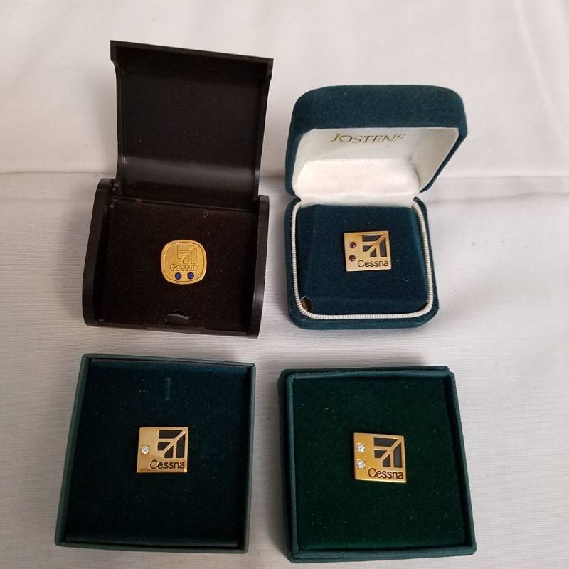 lot 3935 image: 4 Cessna pins - marked 10 karat