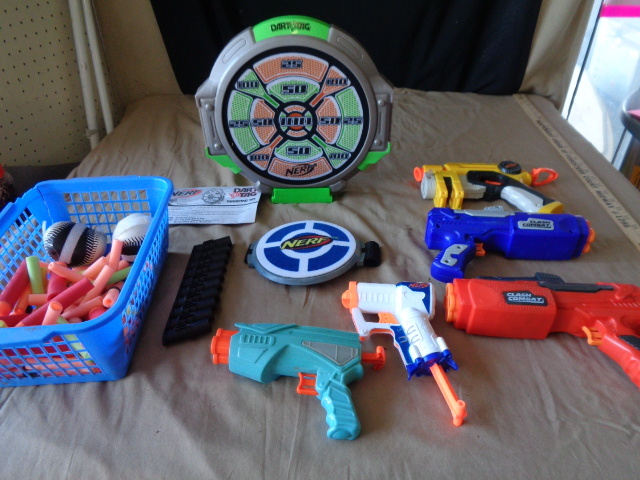 lot 8869 image: NERF..5 Nerf guns, lots of ammo, targets, ect.