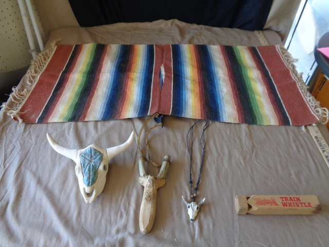 lot 8881 image: Southwestern throw, steer skull, deer slingshot,neckless, & train whistle