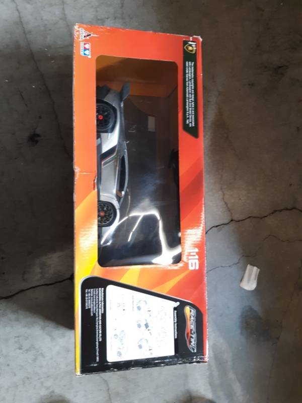 lot 9608 image: Race Tin Motion Sensing Lamborghini- Veneno Vehicle (116 Scale)