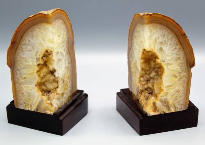 lot 1910 image: Brazilian Geodes Bookends on Wooden Base, Possibly Oco Geodes