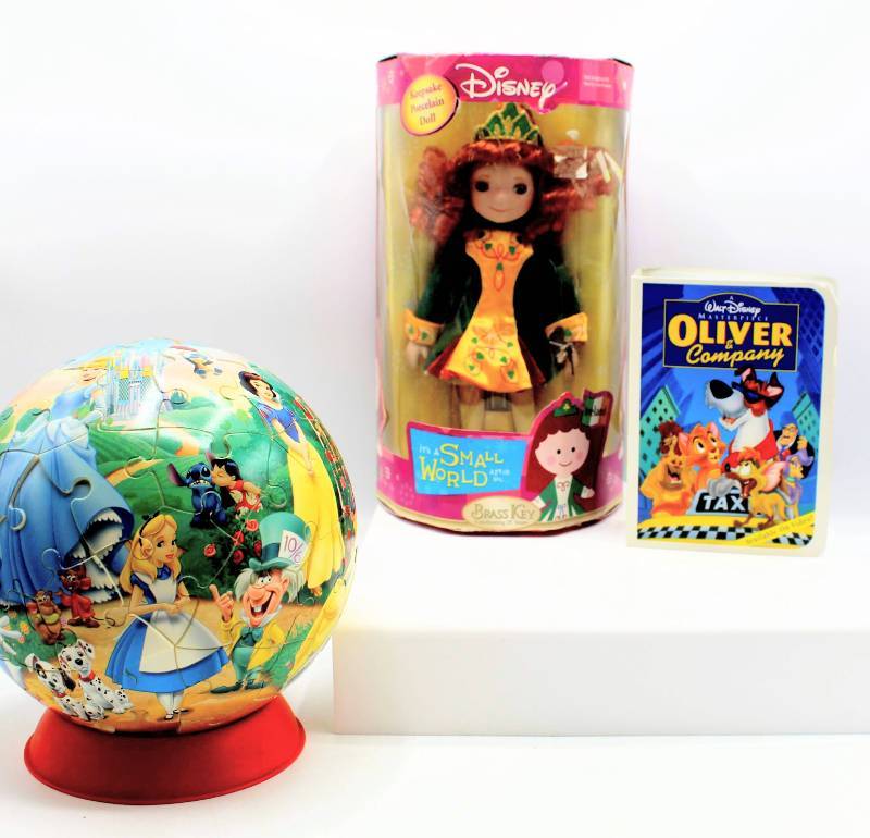 lot 1871 image: Disney Lot - Its a Small World Ireland Doll NIB, Figurine and 3D Sphere Puzzle