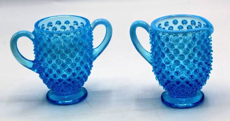 lot 1895 image: Blue Fenton Glass Hobnail Petite Creamer and Sugar Servers
