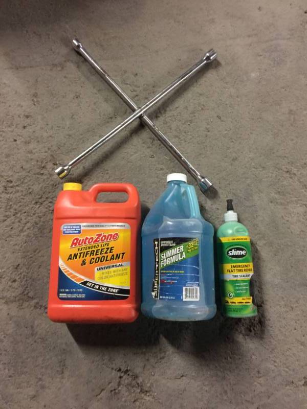 lot 2074 image: 4 Way Lug Remover. AnitFreeze, Windshield Wiper Fluid, Tire Slime