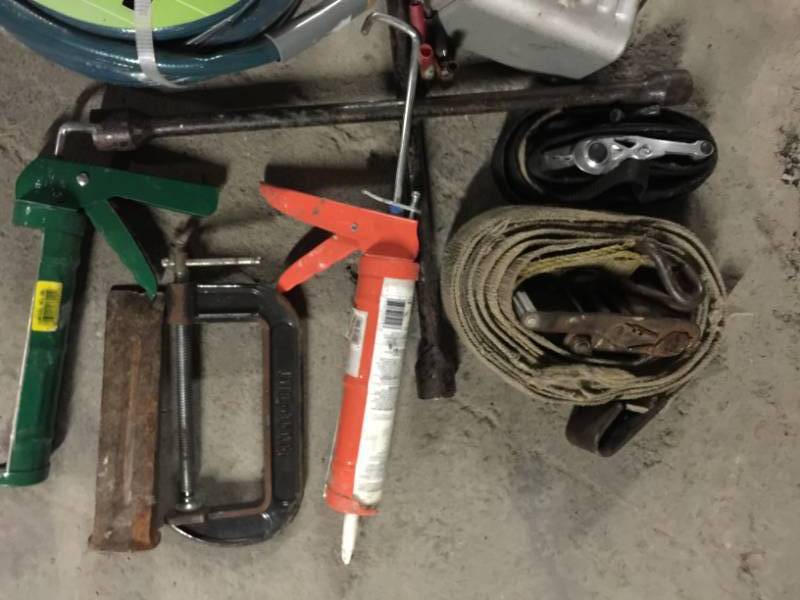 lot 2076 image: Battery Charger, 50 Ft Garden Hose, Caulk Guns and More