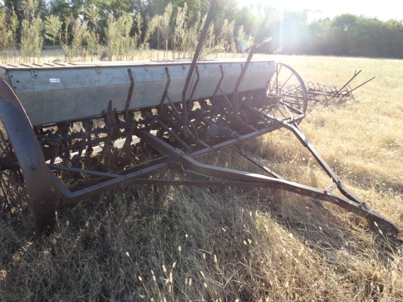 lot 2915 image: Old metal wheel farm implement- Seederplanter