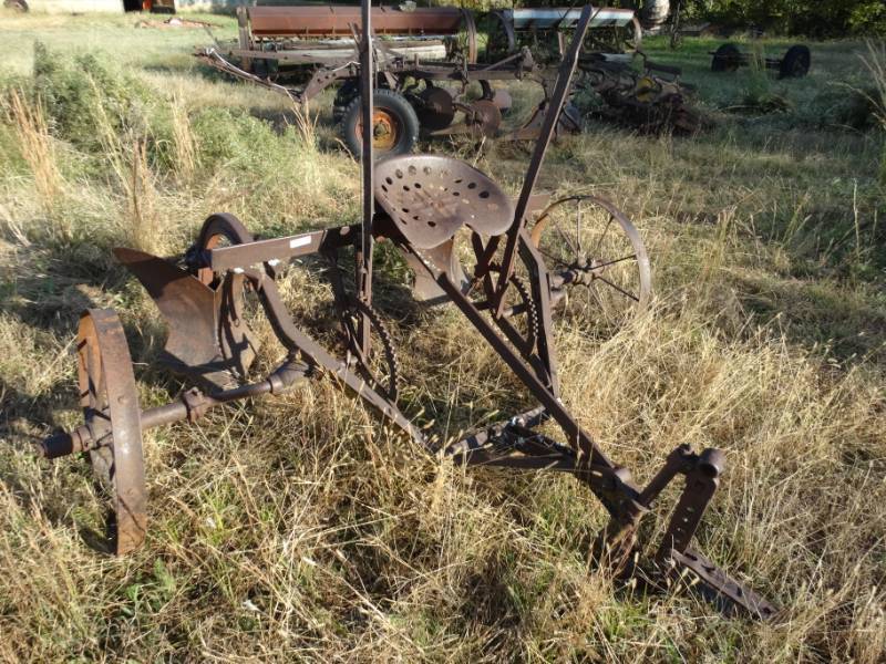 lot 2920 image: Old metal wheel farm implement- 2 bottom plow