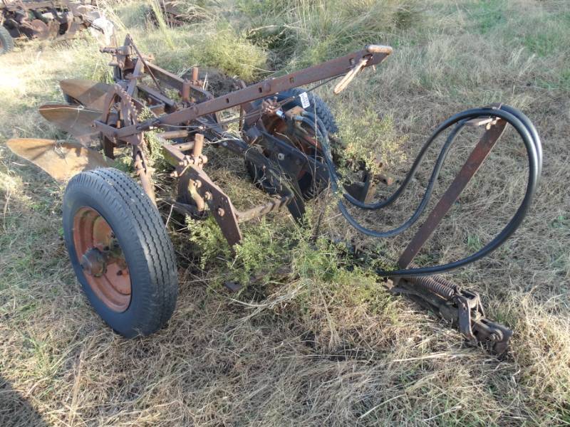 lot 2921 image: Old metal wheel farm implement- pull behind 3 bottom plow