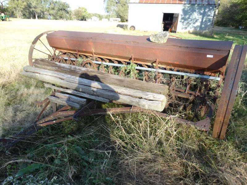 lot 2923 image: Old metal wheel farm implement- pull behind seederplanter