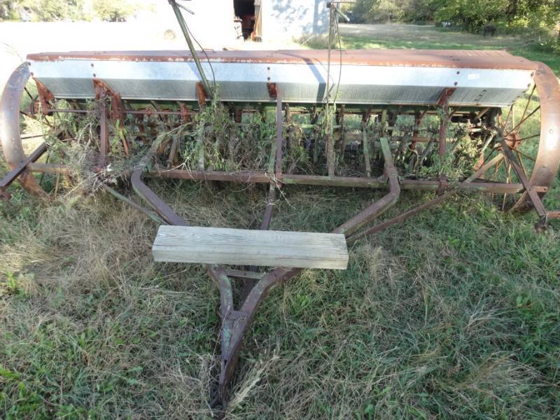 lot 2925 image: Old metal wheel farm implement- Pull behind seederplanter- John Deere