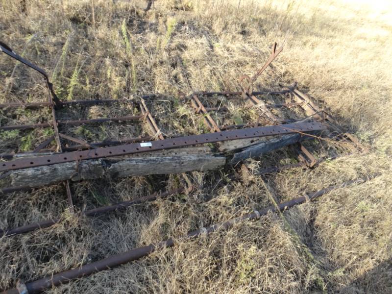 lot 2948 image: Old metal farm implement- Pull behind harrow