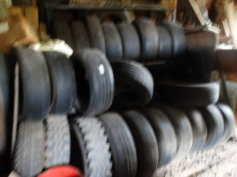 lot 2964 image: Large lot of assorted tires & metal tire rack