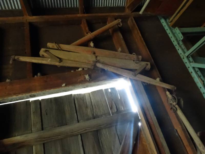 lot 2967 image: Antique horse items 2 handle saw & misc on wall