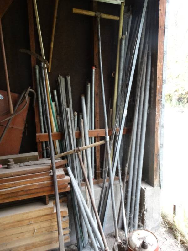 lot 2979 image: Large lot of metal pipe hole diggers & misc.