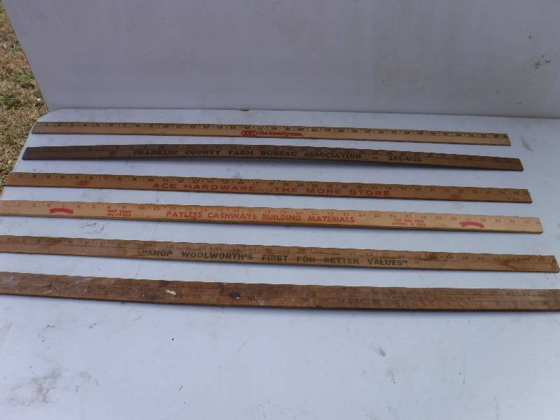 lot 6764 image: Lot of wood yard sticks