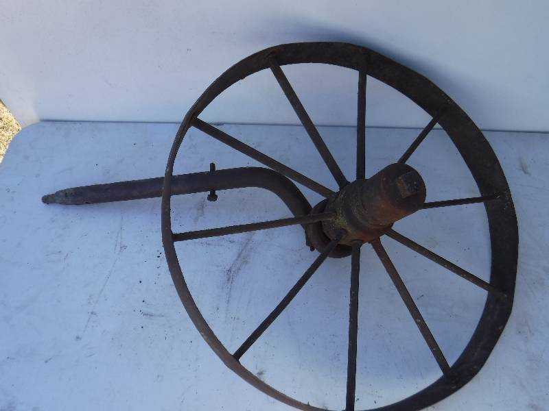 lot 6809 image: Iron axle and 19 12 wheel