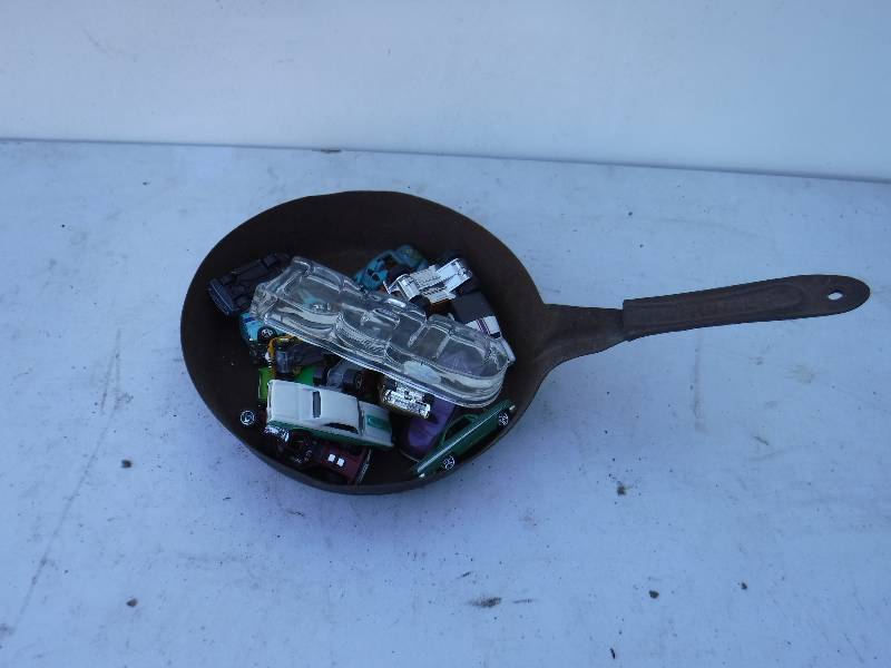 lot 6823 image: Cast iron skillet with misc cars included