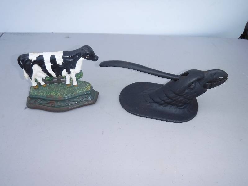lot 7594 image: Wright studios cast iron cow door stop and an eagle