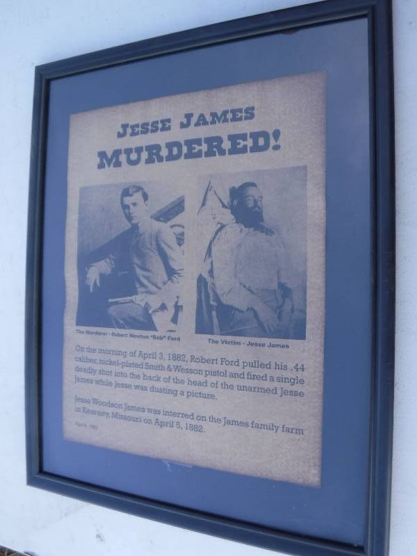 lot 7602 image: Vintage framed news paper articles- The murder of Jesse James and wanted John Wilkes booth