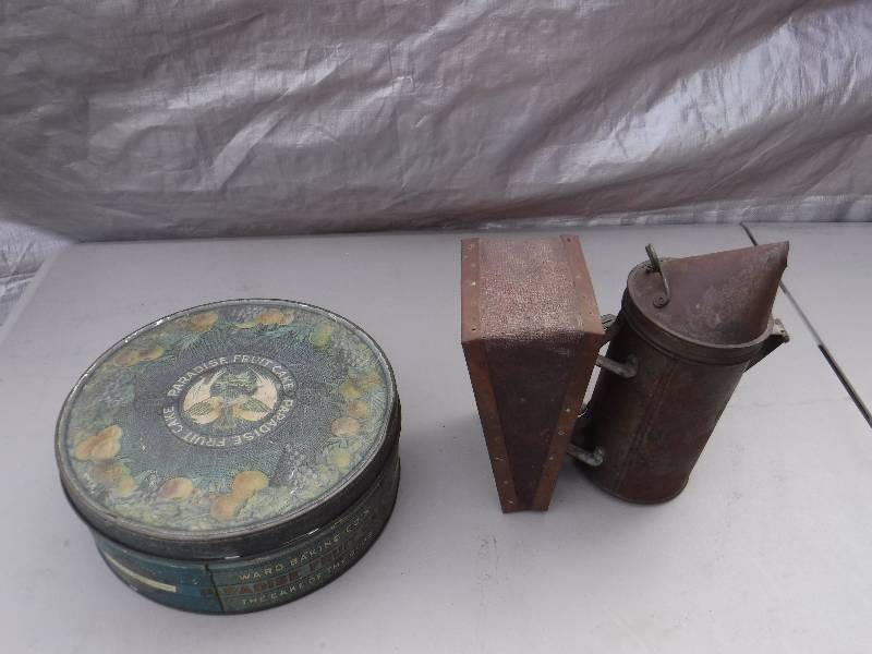 lot 6865 image: Bee smoker and tin