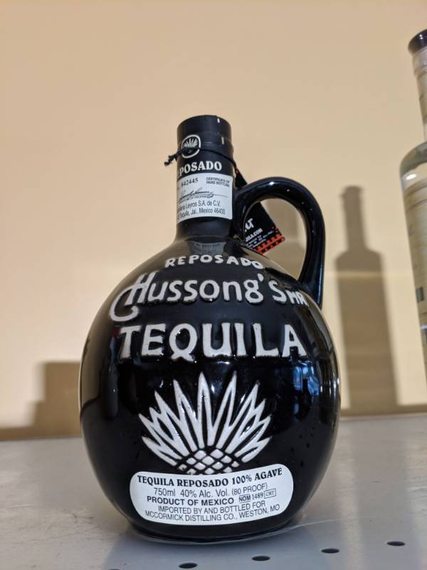 lot 8896 image: (1) 750mL 40 Perc By Volume 80 Proof Hussongs Mr Tequila Pottery Jug -Tequila Reposado 100 Perc Agave - Black Wwhite Gloss Glaze