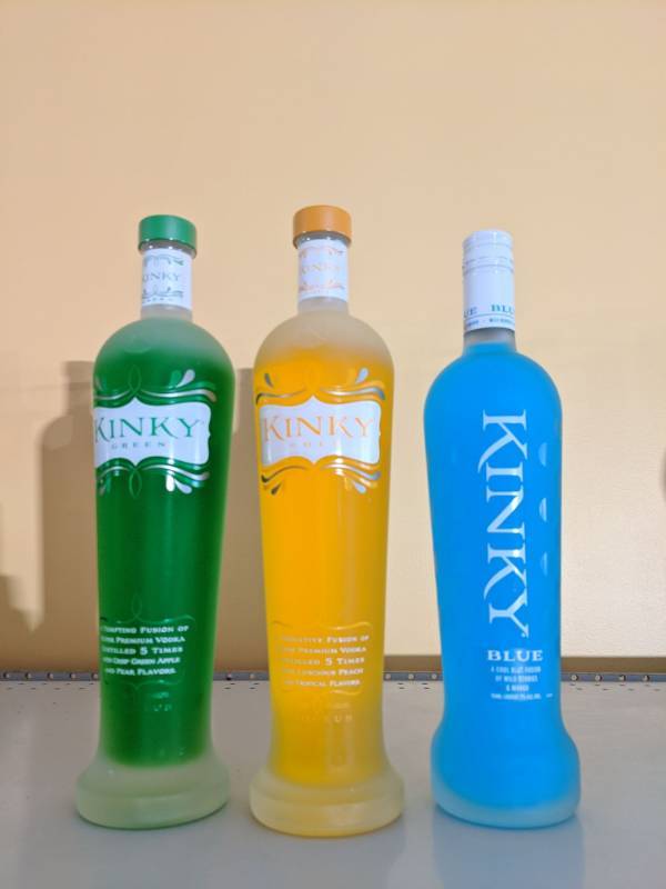 lot 9119 image: (3) 750mL Kinky Liquor Bottles (1) Blue Liqueur, (1) Green, (1) Gold