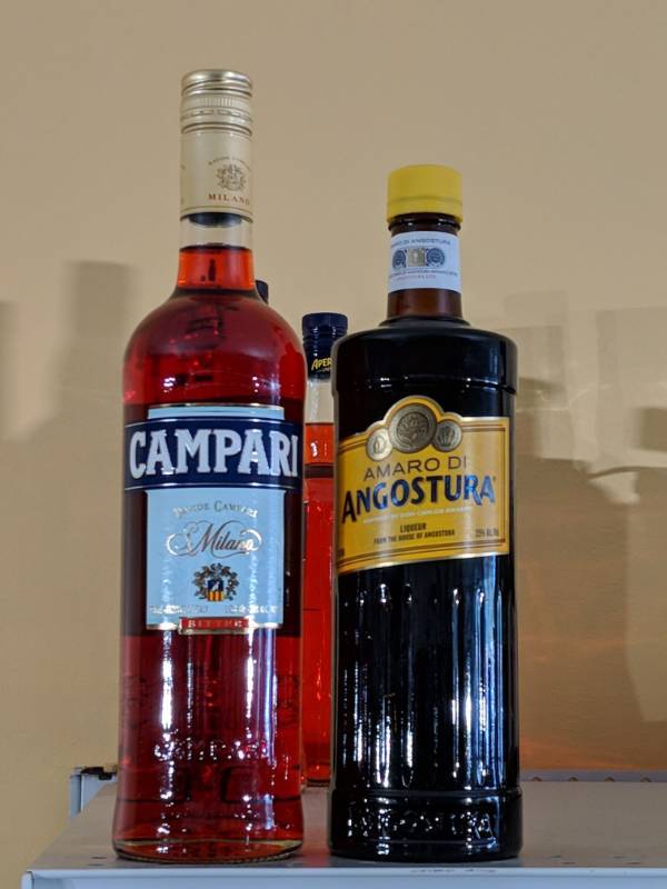 lot 9139 image: (2) 750 ML Bottles Of Bitters (1) Amaro Di Angostura Liqueuer 35 Per Alc By Vol, (1) Campari Bitter Liqueur 24 Per Alc By Vol