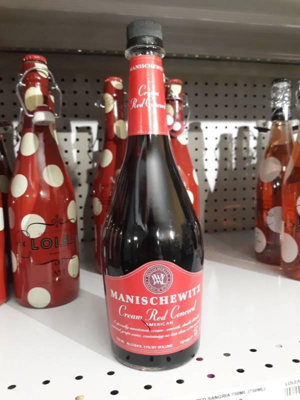 lot 9403 image: (9) Manischewitz Cream Red Concord Wine