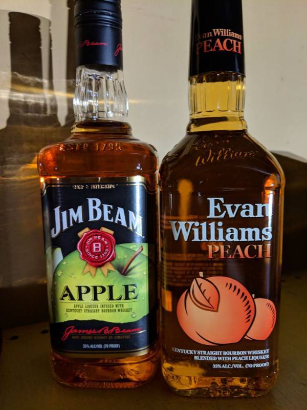 lot 9511 image: (2) 750mL Flavored Whiskey, One Jim Beam Apple 35 Perc Alc By Vol, One Evan Williams Peach 35 Perc Alc By Vol