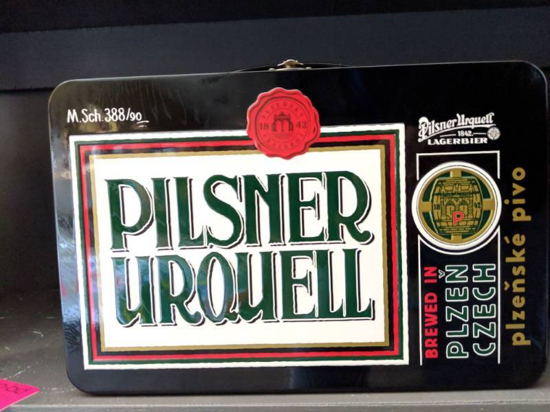 lot 9813 image: (2) Pilsner Urquell Metal Tin Lunch Box, Contains Four Limited Edition 16.9fl Oz Cans 4.4Perc Alc By Vol