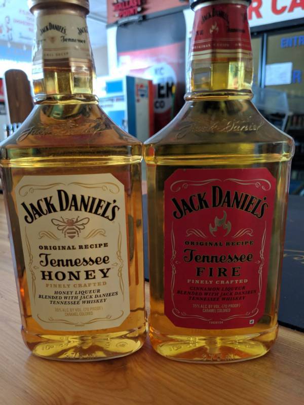 lot 9867 image: (2) 375mL Jack Daniels Flavored Whiskey (1) Tennessee Fire 35Perc Alc By Vol, (1) Tennessee Honey 35Perc Alc By Vol
