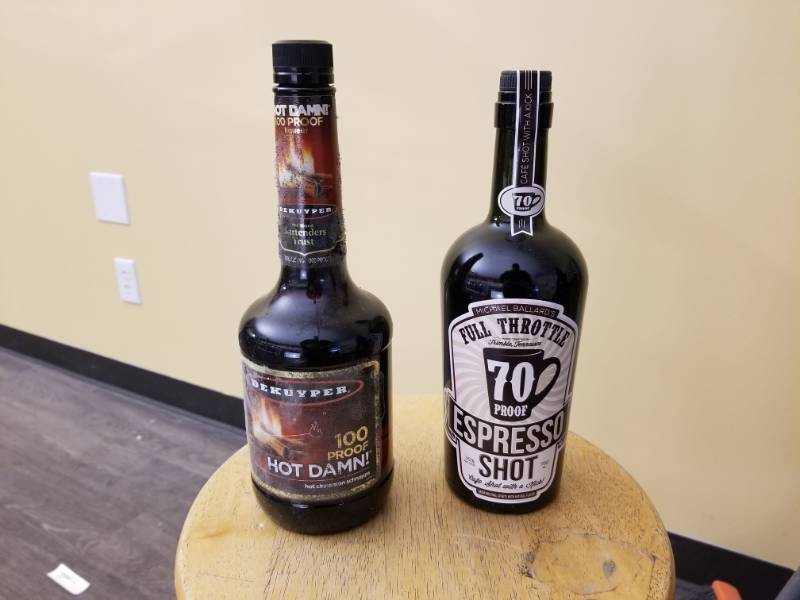 lot 9795 image: 100 Proof Hot Damn 750mL, Full Throttle Expresso Shot 750mL