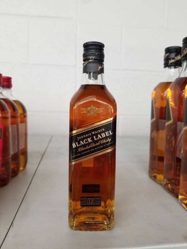 lot 9880 image: (2) Johnny Walkers Black Label 200ML