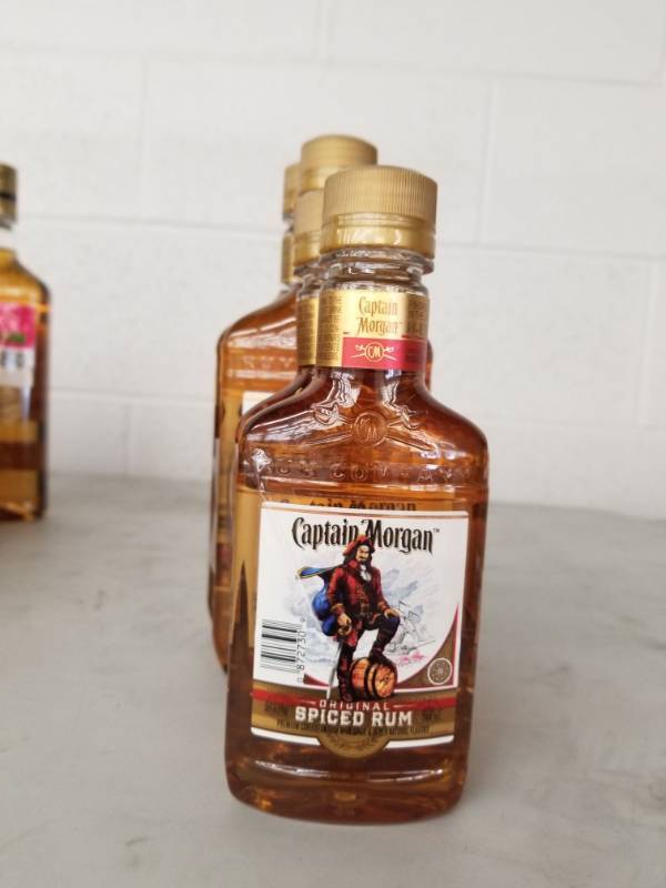 lot 9891 image: (3) 200ML Captain Morgan Spiced Rum, (2) 375ML Captain Morgan Rum