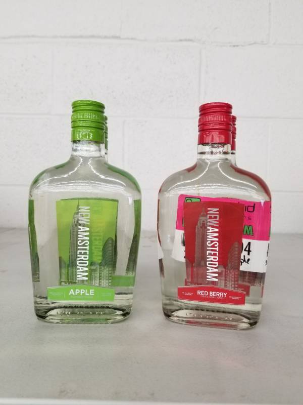 lot 9904 image: (2) New Amsterdam Apple 375ML, (2) Red Berry 375ML