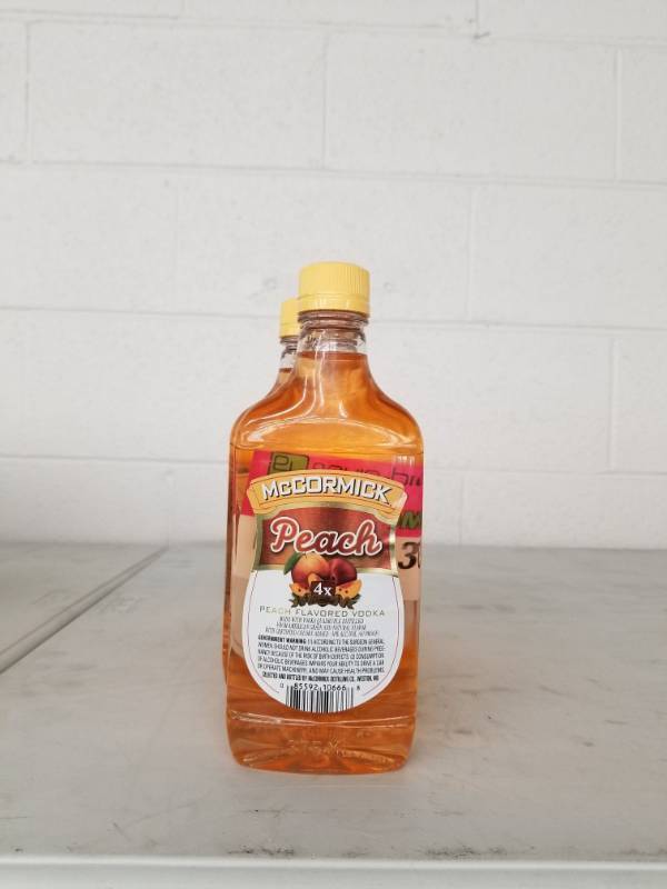 lot 9913 image: (7) McCormick Peach Vodka 375ML