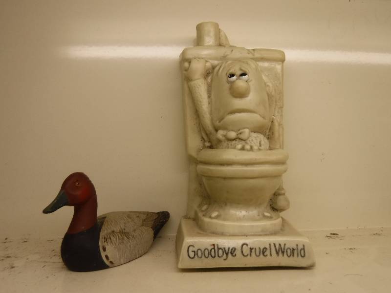 lot 10071 image: Duck figure and goodbye cruel world toilet figure