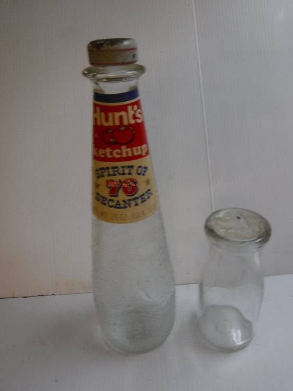 lot 10101 image: Vintage Glass Hunts Ketchup bottle and a half pint bottle